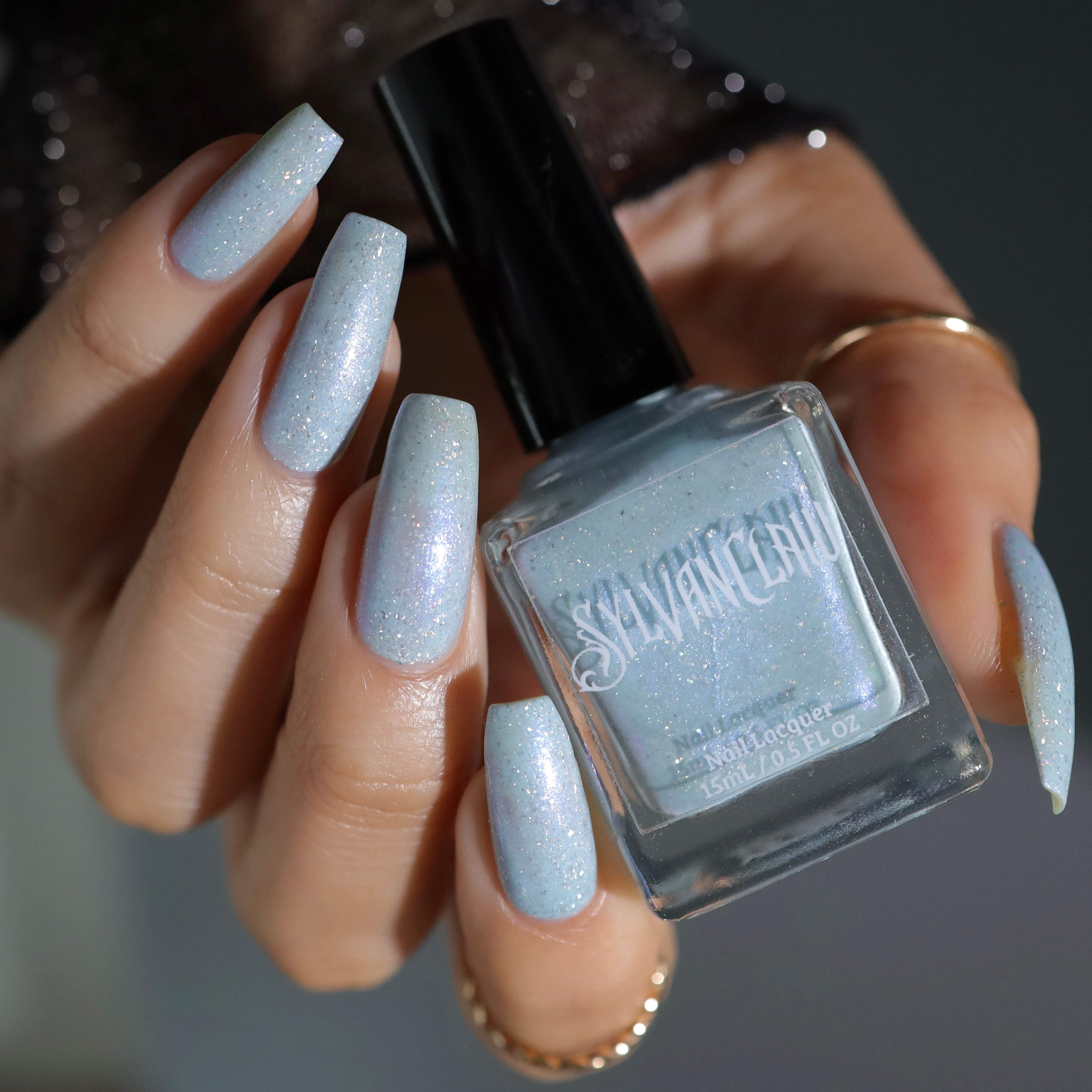 cinderella blue nail polish, shimmer nails, sylvanclaw, bottle image, polishedbookworm
