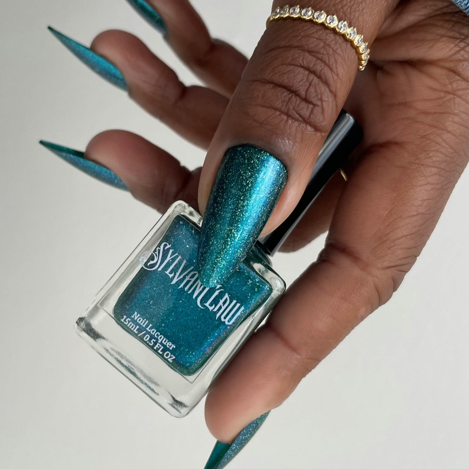 teal holographic nail polish, shimmer nails, sylvanclaw, bottle photo, deeplydipped